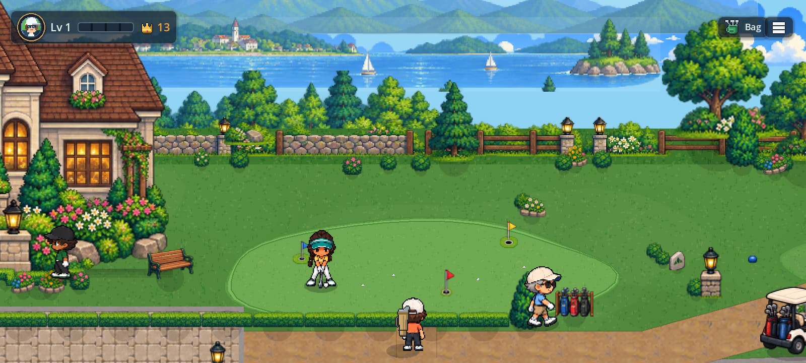 The practice green beside the clubhouse, with the lake and mountains behind.